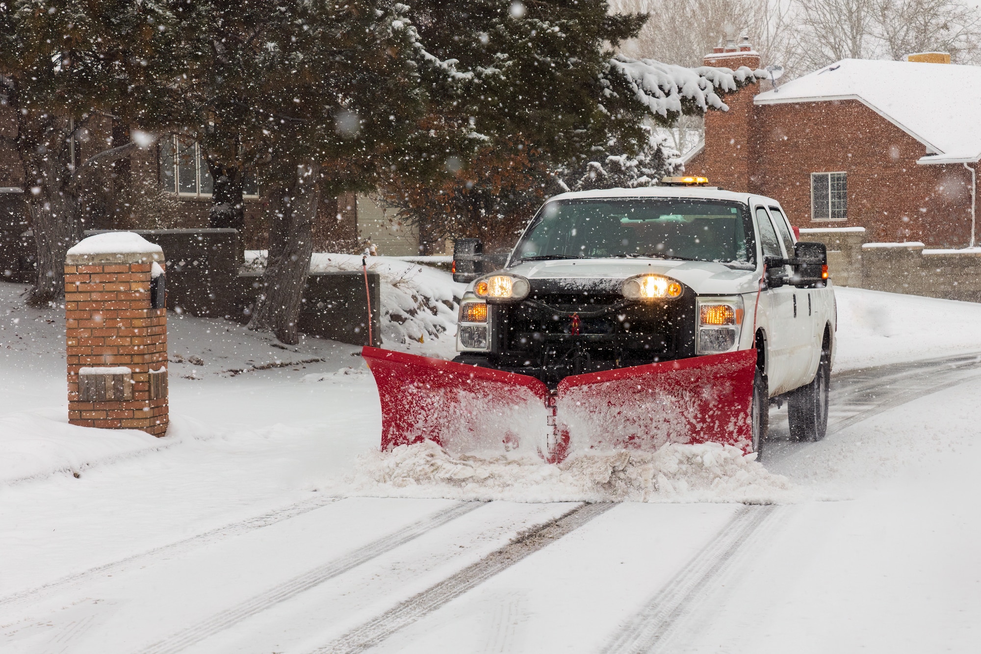 Snow plow clearing side road